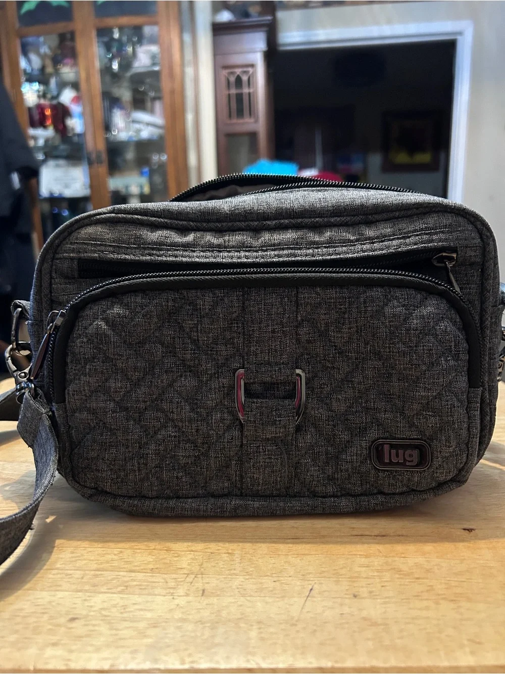 Get organized on the go with this Lug Carousel Crossbody Bag